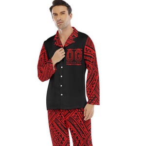May include: Black and red pajama set with a button-down shirt and matching pants. The shirt features the text "OG BLOODLINE" in red, and the sleeves and pants have a red tribal pattern. The pajama set is made of a soft material.