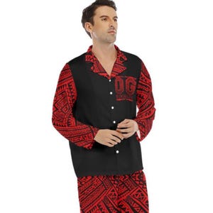 May include: Black and red pajama set with a button-down shirt and matching pants. The shirt has a black front with the text "OG" and "BLOODLINE" in white. The sleeves and pants feature a red tribal pattern.