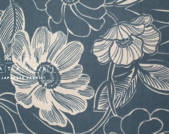 May include: A blue fabric with a white floral pattern. The flowers are stylized and have a delicate, almost vintage look. The fabric has a subtle texture and a soft, slightly faded appearance.