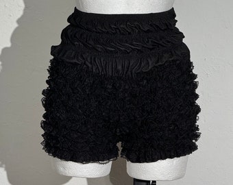 Kokette kleine schwarze Pumphose mit Spitzenrüschen und hoher Taille, Größe M