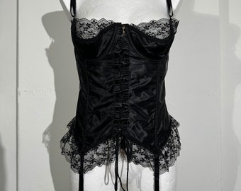 Exquisite black vintage satin corset with suspenders, eyelet tie up front, black lace frills and a little golden key pendant, size XL