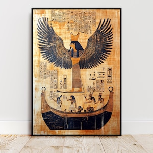 May include: Framed print of an ancient Egyptian artwork. The image features a central figure with large wings, a headdress, and hieroglyphs. A boat with several figures is depicted below the central figure. The artwork is framed in a black frame.