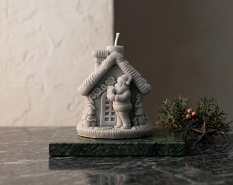 Handmade vegan candle in the shape of a Christmas house with Santa Claus, with coffee, natural wax, eco-friendly gift and Christmas decoration