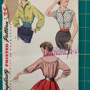 May include: Vintage Simplicity sewing pattern for a blouse with three different styles. The pattern is printed on white paper with black text and illustrations of women wearing the blouse. The pattern number is 35.