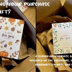 May include: Two gift cards with the text "A gift for you" on a white background with a fall and winter themed design. The cards are in brown paper gift boxes.