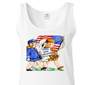 May include: White tank top with a vintage illustration of three children carrying an American flag and a sign that reads "Free and Brave".