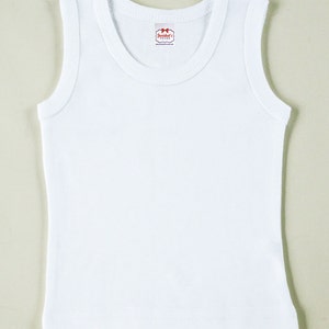 May include: White sleeveless undershirt with a small red label that says "Snoochie's" on it.