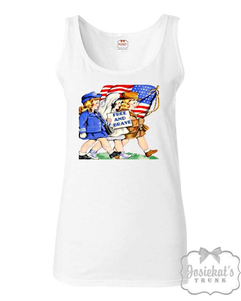 May include: White tank top with a vintage illustration of three children carrying an American flag and a sign that reads "Free and Brave".
