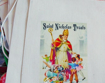 May include: A stack of white fabric gift bags with red stitching. The bags have a printed image of Saint Nicholas giving gifts to children. The image includes the text "Saint Nicholas Treats".