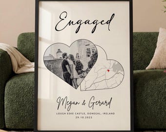 May include: A framed vertical wall art print with a cream background. The text Engaged appears at the top. Below are two overlapping heart shapes: one containing a black and white photograph of a couple, the other a map with a red heart marker. The names Megan & Gerard, the location Lough Eske Castle, Donegal, Ireland, and the date 29.10.2025 are printed at the bottom.