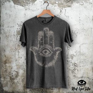 Hamsa Hand T-Shirt – Hand of Fatima Comfort Colors Pepper Tee – Evil Eye Protective Hand Symbol for Positive Energy Fortune and Luck