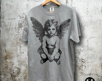 Grunge Distressed Cherub Angel T-Shirt – Dark Vintage Graphic on Gray Comfort Colors Shirt – Unisex Fit Tee For Men or Women