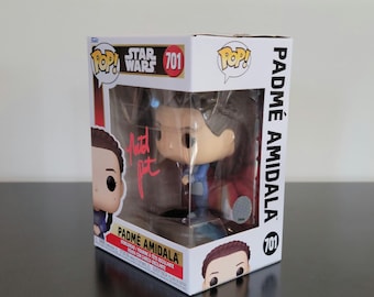May include: A Funko Pop! vinyl figure of Padmé Amidala from Star Wars, number 701, in its original box. The box is white with the Star Wars and Pop! logos. The figure is visible through a clear plastic window.