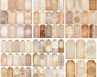 Könnte beinhalten: Eine Sammlung von Papieranhängern im Vintage-Stil in verschiedenen Braun-, Beige- und Rosatönen. Die Anhänger weisen dekorative Spitzen- und Mandala-Designs mit einem verwitterten, gealterten Aussehen auf. Jeder Anhänger hat oben ein kleines Loch zum Auffädeln.