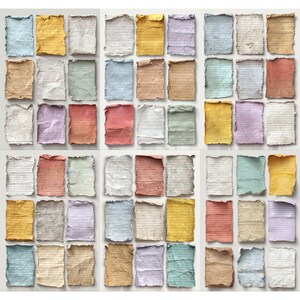 May include: A collection of aged, torn paper sheets in various colors, including blue, yellow, pink, and brown. Each sheet has a lined pattern, suggesting they are from notebooks or journals. The edges are rough, giving a vintage aesthetic.