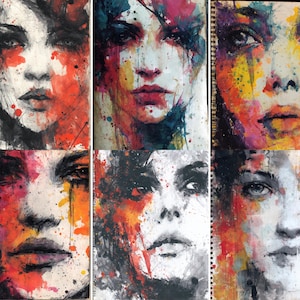 May include: A collection of six abstract portrait paintings. Each artwork features a close-up of a face with bold brushstrokes and a vibrant color palette, including red, orange, yellow, and blue. The portraits are on a textured, off-white surface.