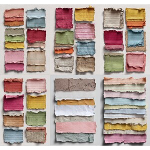 May include: A collection of colorful, torn-edge paper pieces arranged in a grid. The papers vary in color, including pink, yellow, blue, and brown, and some have horizontal lines. The paper has a textured, handmade appearance.