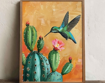 May include: A framed wall art print featuring a vibrant green hummingbird in flight toward a blooming pink flower on a green cactus. The background is a textured, warm orange and yellow gradient, all encased in a simple wooden frame.