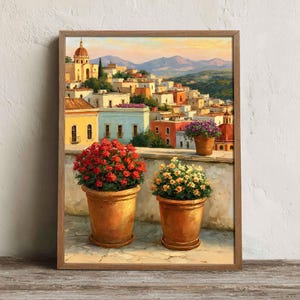 May include: A framed painting depicting a Mediterranean hillside town with colourful buildings and a church dome. In the foreground, two terracotta pots hold vibrant red and yellow flowers, while a third pot with purple flowers sits on a ledge.