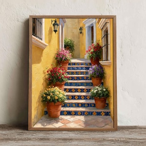 May include: A framed wall art print depicting a sunlit Mediterranean staircase with yellow walls, black iron lanterns, and terracotta pots filled with vibrant red, pink, yellow, and purple flowers resting on blue and yellow patterned tile steps.