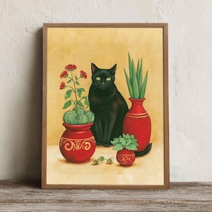 May include: A framed painting featuring a black cat with yellow eyes sitting between three red pots. One pot contains a flowering plant, another holds a tall green plant, and the smallest contains a leafy green plant, all on a yellow background.