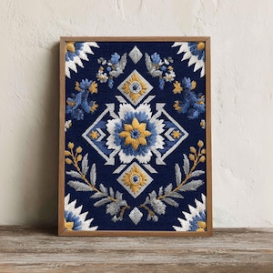 May include: A rectangular framed wall art piece featuring a dark navy blue fabric background with intricate embroidery. The design displays a central yellow and white floral motif surrounded by symmetrical blue and silver leaf patterns.