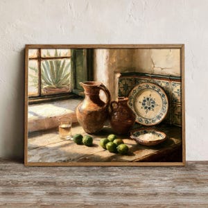 May include: A still life painting featuring two brown ceramic pitchers, a decorative plate with blue floral patterns, a small glass of liquid, and several green limes arranged on a wooden surface near a window with an agave plant.