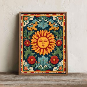 May include: Framed art print featuring a stylized sun with a face, surrounded by floral and foliate designs in shades of yellow, red, green, and blue. The artwork is set against a dark blue background and framed in a wooden frame.