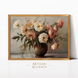 May include: A framed painting depicting a bouquet of pink and white flowers in a brown vase. The flowers are arranged in a loose, natural style, and the vase is simple and elegant. The painting is set against a pale blue background.