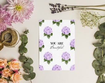 Postcard with flowers in watercolor style with the inscription "You are beautiful"