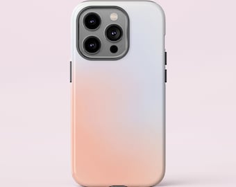May include: A white phone case with a gradient design that fades from light blue to peach. The case has a black camera bump with three lenses.