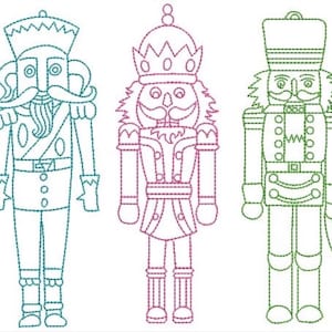 May include: Three nutcracker figures rendered in a dashed-line embroidery style. The left figure is teal, the center figure is magenta, and the right figure is green. Each nutcracker features distinct uniforms, hats, and facial hair details.