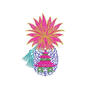 May include: Embroidered pineapple design with a pink flower on top and a blue pagoda in the center. The pineapple is surrounded by blue leaves.