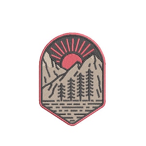 May include: A brown and black embroidered patch with a mountain scene. The patch features a red sun rising over the mountains with a lake in the foreground. There are five trees in the foreground.