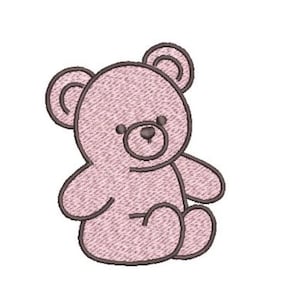 May include: A light pink embroidered teddy bear patch featuring a dark brown stitched outline. The design shows a seated bear with rounded ears, a circular muzzle, and a small nose, rendered in a dense thread pattern on a plain white background.