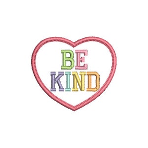 May include: A pink heart with the words "BE KIND" in rainbow colours inside.