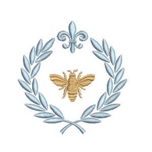 May include: An embroidery design featuring a central golden bee surrounded by a light blue laurel wreath. Above the wreath is a light blue fleur-de-lis symbol. The entire composition is rendered in detailed thread work on a plain white background.