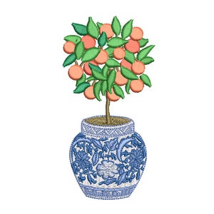 May include: A small orange tree with green leaves and orange fruit growing in a blue and white ceramic pot with a floral design.