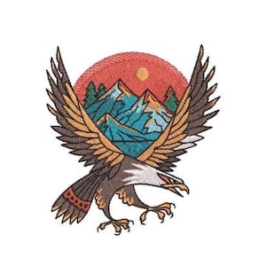 May include: An embroidered patch featuring a bald eagle with wings spread wide. The eagle is brown, white, and tan. Behind the eagle is a circular scene depicting blue mountains, green pine trees, and a yellow sun set against a red background.