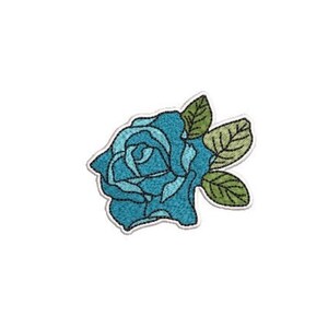 May include: An embroidered patch featuring a blue rose with layered petals in shades of light and dark blue. The rose is accompanied by three green leaves with visible dark green stitching for veins, all outlined with a white border.