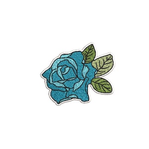 May include: A blue embroidered rose with green leaves. The rose is a single bloom with a light blue center and darker blue petals.