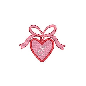 May include: A pink heart with a red outline and a white letter "S" inside. The heart has a pink ribbon tied around it.