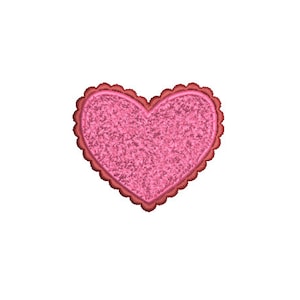 Puede incluir: Un parche rosa en forma de corazón con un borde festoneado y una superficie texturizada.