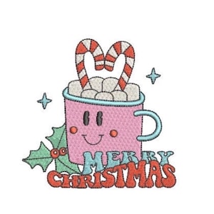 May include: An embroidered design featuring a pink mug with a smiling face, filled with marshmallows and two candy canes. The mug is accented by green holly leaves with red berries, two small blue stars, and the text MERRY CHRISTMAS in red.