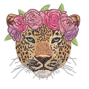 May include: An embroidered patch featuring the head of a leopard with a tan coat and black spots. The leopard has blue eyes and is wearing a crown of pink and purple roses with green leaves. The design includes detailed stitching and whiskers.