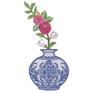 May include: A blue and white porcelain vase with a floral design, holding a bouquet of pink and white flowers.