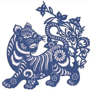 May include: A blue and white embroidered patch featuring a stylised tiger standing in profile. The tiger has intricate white striped patterns and is positioned next to a tall, slender plant with several small, rounded leaves and flowers.