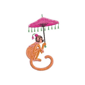 May include: An embroidered patch featuring an orange monkey with a long curled tail, wearing a small pink fez hat with a tassel. The monkey holds a pink parasol with green fringe trim and a dark handle, rendered in detailed thread work.