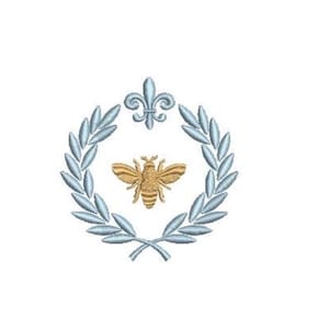 May include: An embroidered design featuring a golden bee centered within a light blue laurel wreath. A light blue fleur-de-lis sits at the top of the wreath. The entire emblem is composed of detailed stitching on a plain white background.