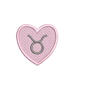 May include: A pink heart-shaped patch with a grey Taurus zodiac symbol in the centre.